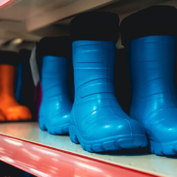 Collection of rubber boots in a clothing store.